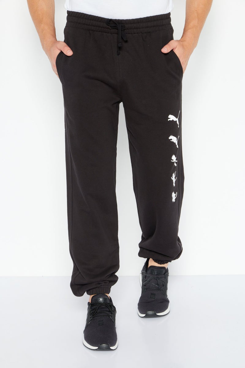 PUMA Men Regular Fit Graphic Printed Sweatpants, Black - Image 1